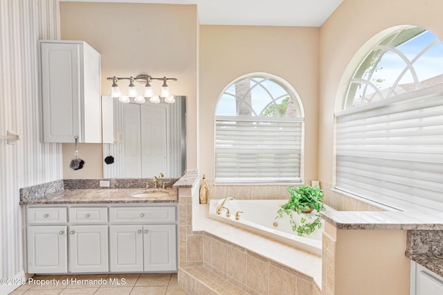 5182 Championship Cup Ln, Spring Hill, FL 34609 - bathroom with vanity, a whirlpool tub, and tile patterned floors