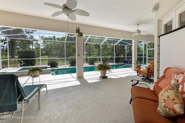 5182 Championship Cup Ln, Spring Hill, FL 34609 - swimming pool featuring ceiling fan, a patio area, and glass enclosure
