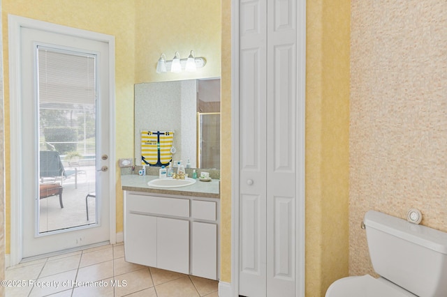 5182 Championship Cup Ln, Spring Hill, FL 34609 - full bathroom featuring a closet, tile patterned flooring, vanity, a stall shower, and toilet