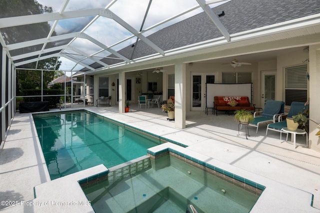 5182 Championship Cup Ln, Spring Hill, FL 34609 - view of swimming pool featuring a ceiling fan, a patio, a pool with connected hot tub, an outdoor living space, and glass enclosure