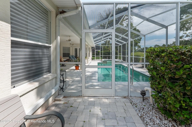 5182 Championship Cup Ln, Spring Hill, FL 34609 - view of pool featuring ceiling fan, a patio, glass enclosure, and a pool with connected hot tub