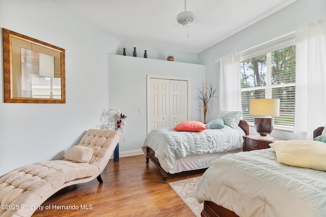 5182 Championship Cup Ln, Spring Hill, FL 34609 - bedroom with wood finished floors, a closet, and baseboards