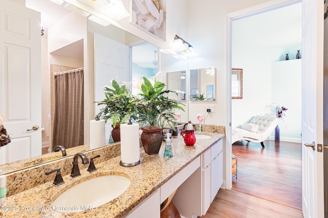 5182 Championship Cup Ln, Spring Hill, FL 34609 - full bath with wood finished floors and double vanity