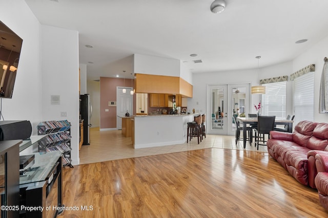 5182 Championship Cup Ln, Spring Hill, FL 34609 - living room featuring light wood-style floors and baseboards