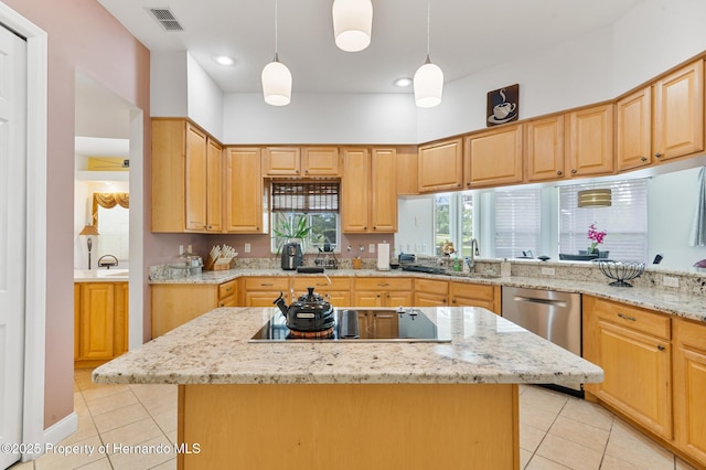 5182 Championship Cup Ln, Spring Hill, FL 34609 - kitchen featuring light tile patterned floors, a sink, dishwasher, black electric stovetop, and light stone countertops