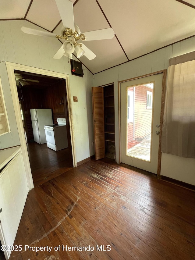 15306 Spokane Rd, Spring Hill Pasco, FL 34610 - spare room with a ceiling fan, wood-type flooring, lofted ceiling, and wooden walls