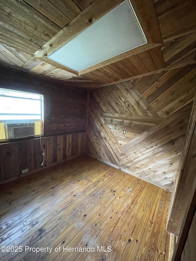15306 Spokane Rd, Spring Hill Pasco, FL 34610 - bonus room with wooden walls, wooden ceiling, cooling unit, and wood-type flooring