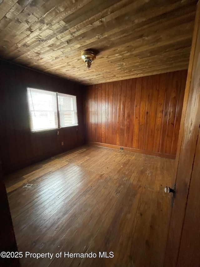 15306 Spokane Rd, Spring Hill Pasco, FL 34610 - unfurnished room with wooden ceiling, hardwood / wood-style floors, and wood walls