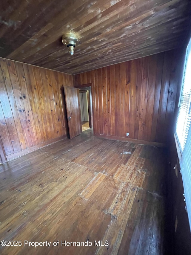 15306 Spokane Rd, Spring Hill Pasco, FL 34610 - spare room with wood-type flooring, wood ceiling, and wooden walls