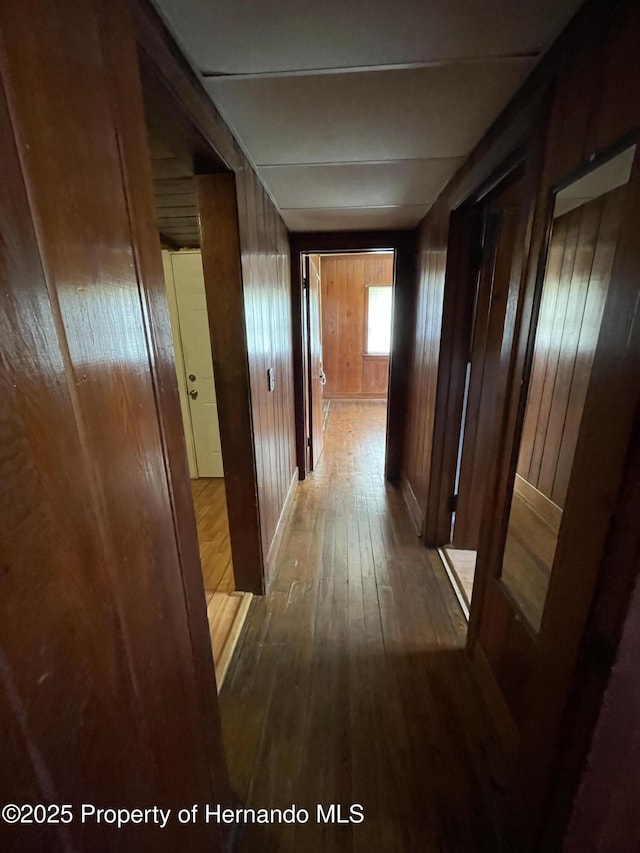 15306 Spokane Rd, Spring Hill Pasco, FL 34610 - hall featuring hardwood / wood-style flooring and wood walls