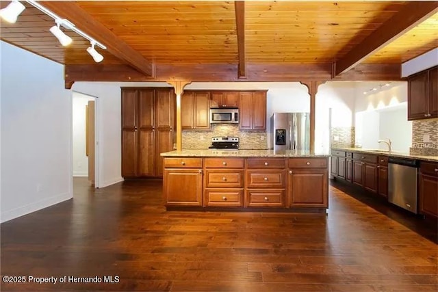 39127 Pretty Pond Rd, Zephyrhills, FL 33540 - kitchen featuring stainless steel appliances, wooden ceiling with exposed beams, dark wood-style floors, decorative backsplash, and rail lighting