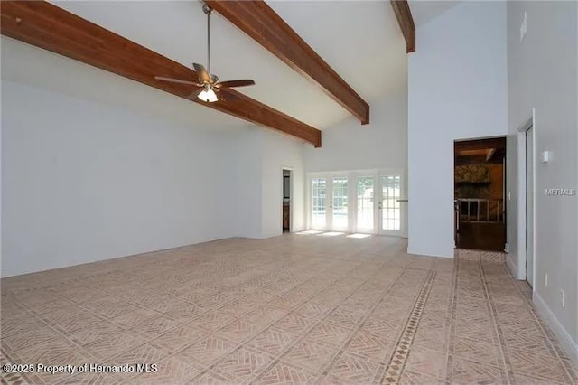 39127 Pretty Pond Rd, Zephyrhills, FL 33540 - unfurnished living room featuring high vaulted ceiling, beamed ceiling, and ceiling fan