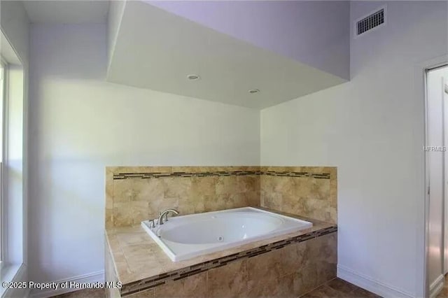 39127 Pretty Pond Rd, Zephyrhills, FL 33540 - bathroom with a bath and baseboards