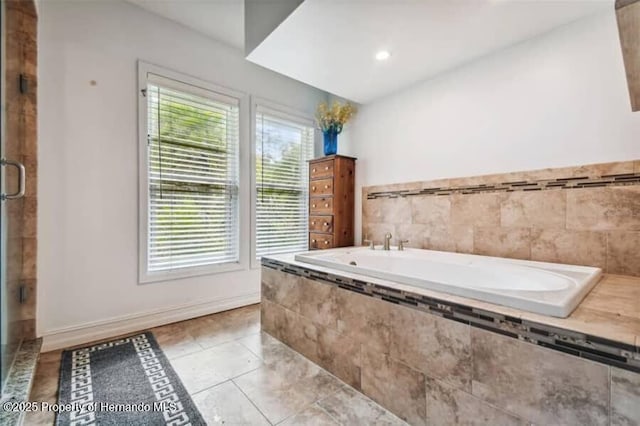 39127 Pretty Pond Rd, Zephyrhills, FL 33540 - bathroom featuring a garden tub, tile patterned flooring, and a shower stall