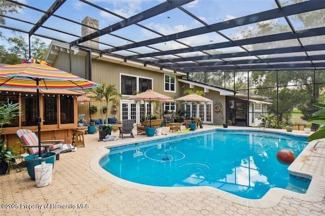39127 Pretty Pond Rd, Zephyrhills, FL 33540 - outdoor pool featuring a patio, french doors, an outdoor hangout area, and glass enclosure