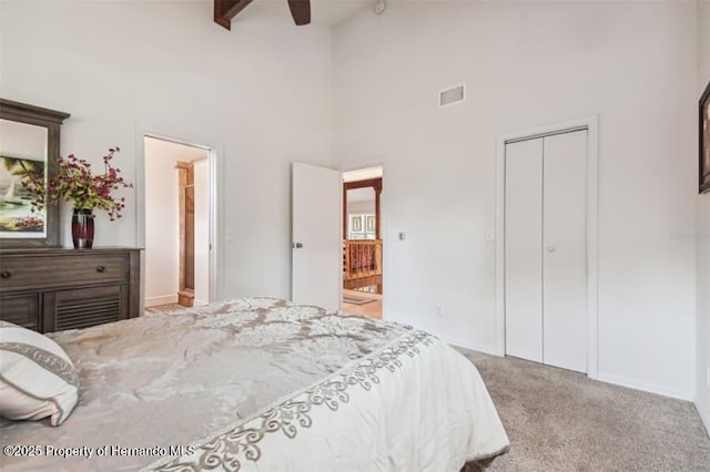 39127 Pretty Pond Rd, Zephyrhills, FL 33540 - bedroom featuring a high ceiling, carpet floors, a closet, beamed ceiling, and a ceiling fan