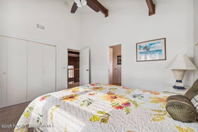 39127 Pretty Pond Rd, Zephyrhills, FL 33540 - carpeted bedroom with beamed ceiling, a closet, a towering ceiling, and a ceiling fan