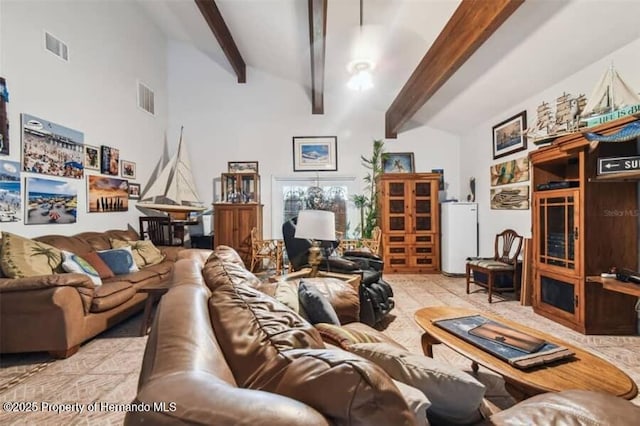 39127 Pretty Pond Rd, Zephyrhills, FL 33540 - living room featuring water heater and beam ceiling
