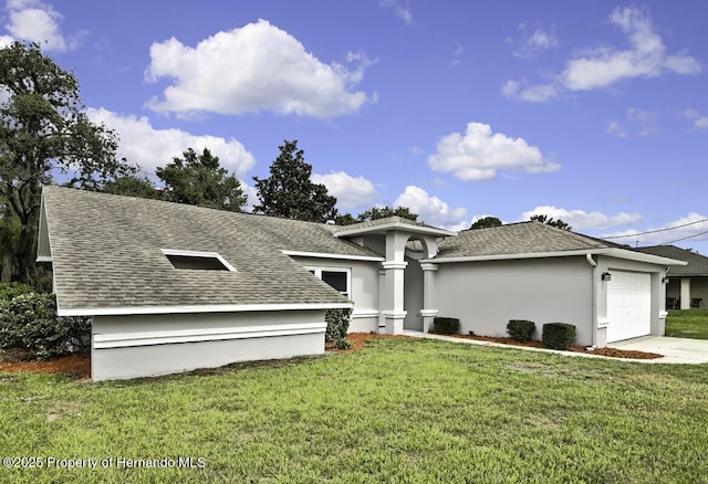 13406 Banyan Rd, Spring Hill, FL 34609 - view of front of property featuring an attached garage, a shingled roof, a front lawn, driveway, and stucco siding