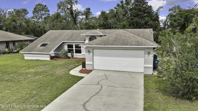 13406 Banyan Rd, Spring Hill, FL 34609 - view of front of property featuring roof with shingles, concrete driveway, a front lawn, an attached garage, and stucco siding