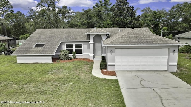 13406 Banyan Rd, Spring Hill, FL 34609 - view of front of property featuring a shingled roof, a garage, concrete driveway, and a front yard