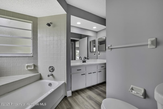 13406 Banyan Rd, Spring Hill, FL 34609 - full bath featuring toilet, wood finished floors, vanity, and healthy amount of natural light