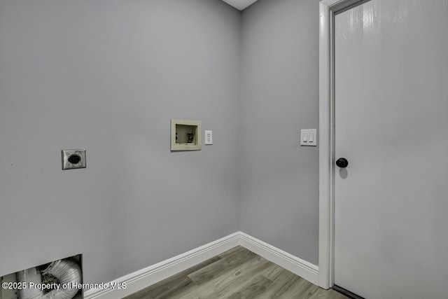 13406 Banyan Rd, Spring Hill, FL 34609 - laundry room with washer hookup, hookup for an electric dryer, baseboards, and wood finished floors