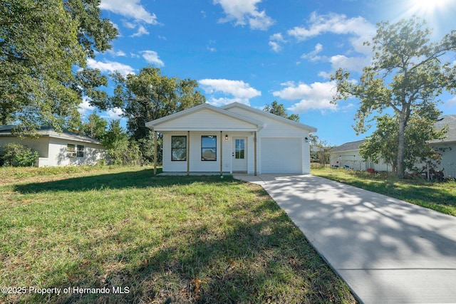 14376 Earline Ave, Weeki Wachee, FL 34614 - ranch-style home with a garage, concrete driveway, a front yard, and a porch