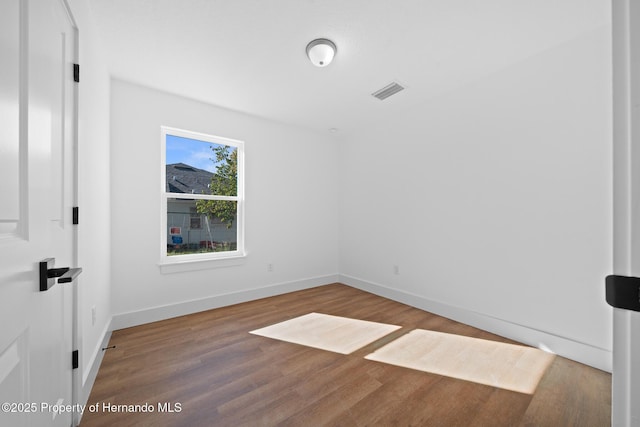 14376 Earline Ave, Weeki Wachee, FL 34614 - empty room with wood finished floors and baseboards