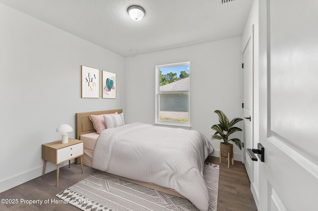14376 Earline Ave, Weeki Wachee, FL 34614 - bedroom with wood finished floors and baseboards