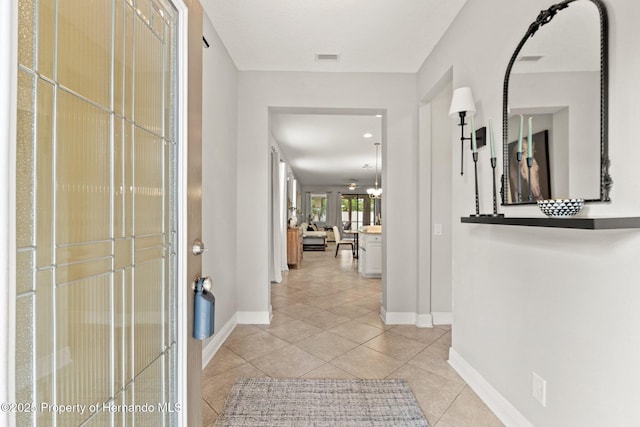 18620 Rococo Rd, Spring Hill Pasco, FL 34610 - hallway with baseboards and light tile patterned floors