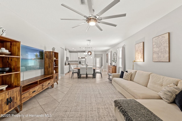 18620 Rococo Rd, Spring Hill Pasco, FL 34610 - living area featuring light tile patterned flooring and a ceiling fan