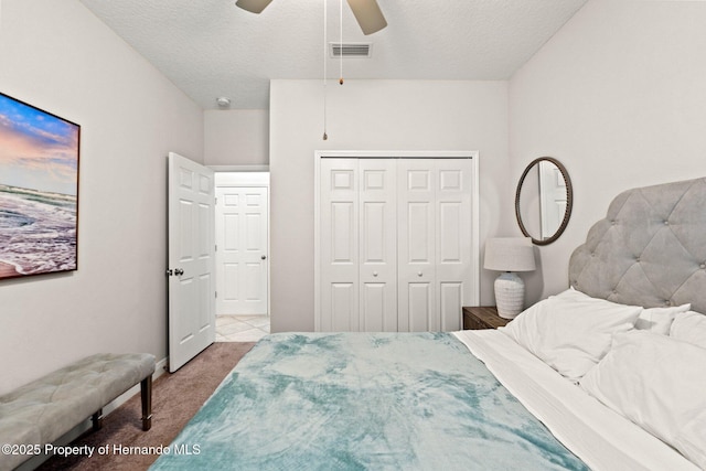 18620 Rococo Rd, Spring Hill Pasco, FL 34610 - bedroom featuring carpet flooring, a closet, a textured ceiling, ceiling fan, and baseboards
