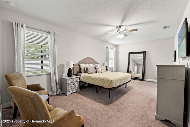 18620 Rococo Rd, Spring Hill Pasco, FL 34610 - carpeted bedroom featuring a textured ceiling, baseboards, and ceiling fan