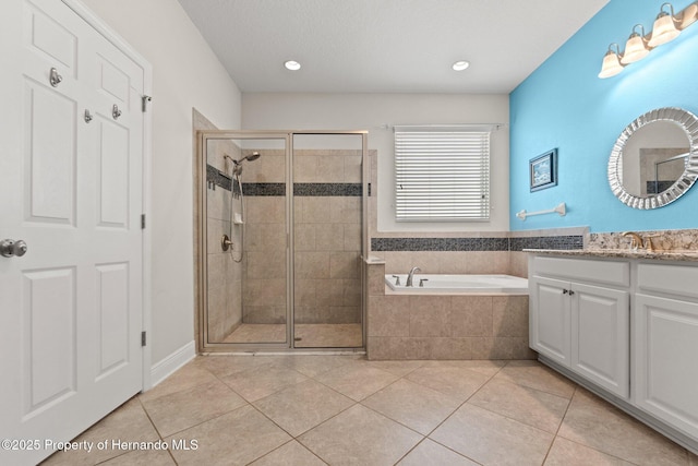 18620 Rococo Rd, Spring Hill Pasco, FL 34610 - full bathroom with vanity, a garden tub, a stall shower, tile patterned floors, and recessed lighting