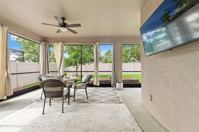 18620 Rococo Rd, Spring Hill Pasco, FL 34610 - sunroom featuring a textured wall, ceiling fan, outdoor dining area, and a textured ceiling
