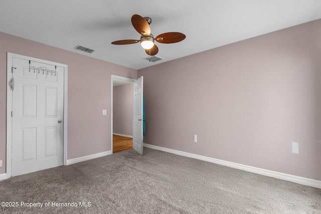 10457 Cranston St, Spring Hill, FL 34608 - unfurnished bedroom with carpet, baseboards, and a ceiling fan