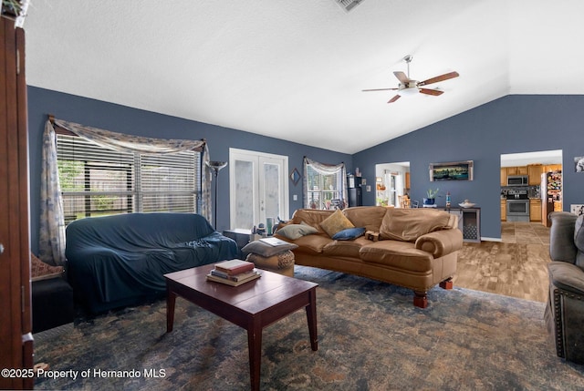 10457 Cranston St, Spring Hill, FL 34608 - living area with vaulted ceiling, ceiling fan, french doors, and light wood finished floors