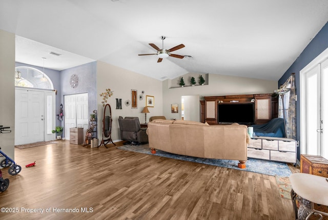 10457 Cranston St, Spring Hill, FL 34608 - living room featuring wood finished floors, ceiling fan, and lofted ceiling