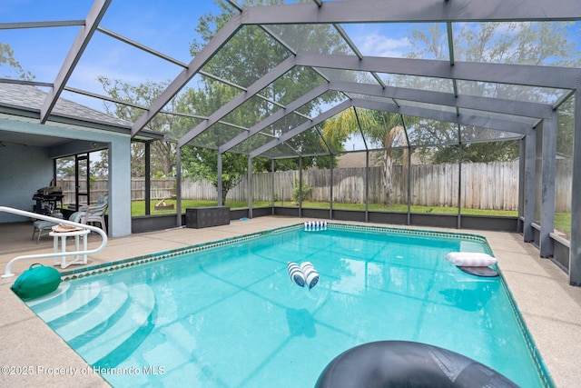 10457 Cranston St, Spring Hill, FL 34608 - view of pool featuring a fenced backyard, a patio area, and a lanai
