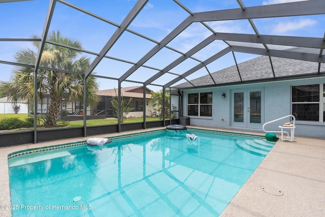 10457 Cranston St, Spring Hill, FL 34608 - outdoor pool featuring french doors, glass enclosure, and a patio area