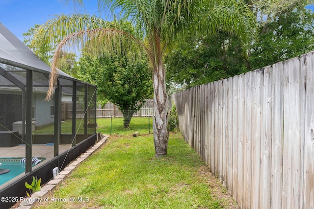 10457 Cranston St, Spring Hill, FL 34608 - view of yard featuring glass enclosure and a patio area