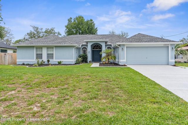 10457 Cranston St, Spring Hill, FL 34608 - single story home featuring stucco siding, an attached garage, driveway, and roof with shingles