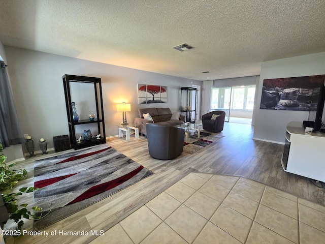 2429 Birdie Ln, Spring Hill, FL 34606 - living area with wood finished floors and a textured ceiling