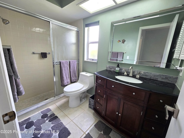 2429 Birdie Ln, Spring Hill, FL 34606 - full bath featuring a shower stall, vanity, and tile patterned flooring