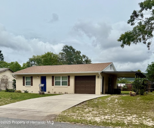 2234 Marietta Ave, Spring Hill, FL 34608 - ranch-style house featuring a front lawn, a garage, concrete driveway, and roof with shingles