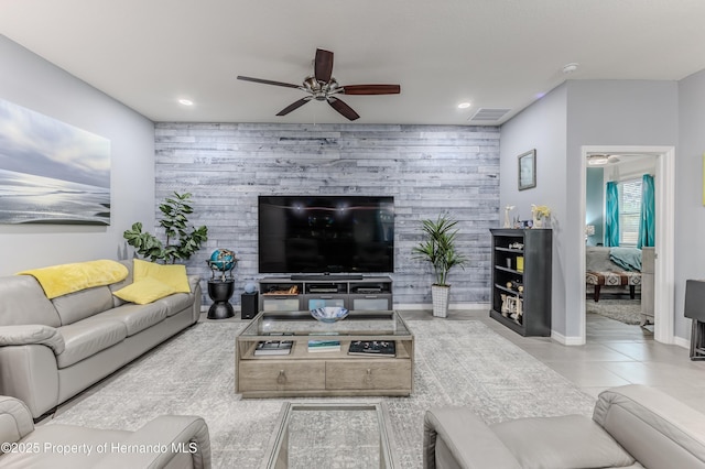 17679 Garsalaso Cir, Brooksville, FL 34604 - tiled living room with a ceiling fan, recessed lighting, and an accent wall