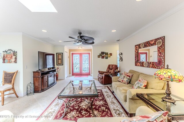 2481 Whispering Pines Ct, Spring Hill, FL 34606 - living room with recessed lighting, a skylight, baseboards, ornamental molding, and light tile patterned floors