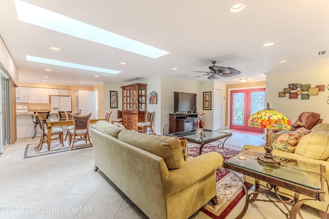 2481 Whispering Pines Ct, Spring Hill, FL 34606 - living area featuring a skylight, crown molding, recessed lighting, and light tile patterned flooring