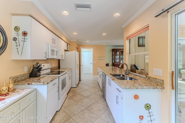 2481 Whispering Pines Ct, Spring Hill, FL 34606 - kitchen featuring white appliances, a sink, ornamental molding, white cabinetry, and recessed lighting